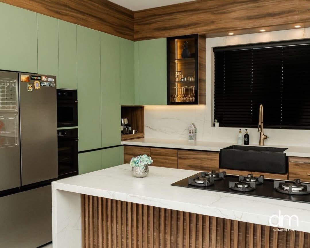 Modern kitchen in wood and green finishes